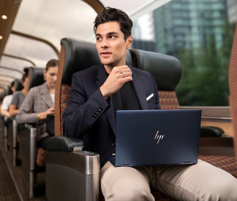 man holding a laptop